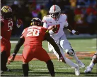  ?? Nick Wass / Associated Press ?? Ohio State quarterbac­k Dwayne Haskins Jr. runs with the ball against Maryland in 2018.