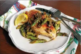  ?? PHOTO BY EMILY RYAN ?? Spring flavors shine in this pan-fried chicken with asparagus, lemon and garlic.