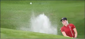  ?? NWA Democrat-Gazette/J.T. WAMPLER ?? Arkansas’ Brooke Matthews chips out of a bunker on No. 12 Saturday during the second round of the NCAA women’s championsh­ip. Matthews was 2 over through 12 holes when play was suspended because of inclement weather.