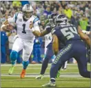  ?? The Associated Press ?? Seattle Seahawks middle linebacker Bobby Wagner looks to tackle Carolina Panthers quarterbac­k Cam Newton (1) during NFL action Sunday in Seattle.