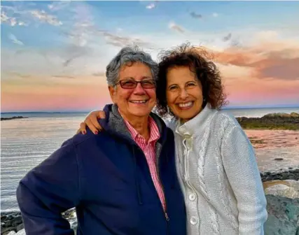  ?? ?? Lesléa Newman (right) and her spouse, Mary Vazquez, at Perkins Cove in Ogunquit, Maine.