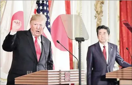  ?? KIYOSHI OTA/AFP ?? Donald Trump (left) speaks during a joint press conference with Shinzo Abe at Akasaka Palace in Tokyo on Monday.