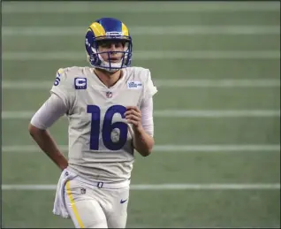  ?? Associated Press ?? INJURED — Los Angeles Rams quarterbac­k Jared Goff jogs on to the field during the second half of an NFL football game against the Seattle Seahawks on Sunday in Seattle. The Seahawks won 20-9. Goff broke his thumb and underwent surgery on Monday.