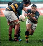  ??  ?? Te Toiroa Tahurioran­gi of Taranaki passes the ball.