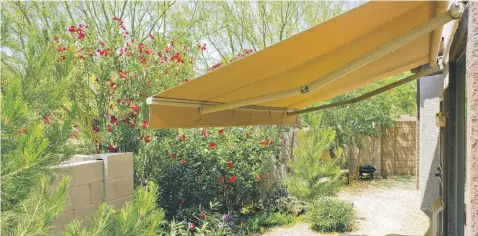  ??  ?? Homeowners may find an awning is a worthwhile investment that benefits both the interior and exterior of the home.