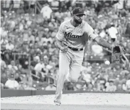  ?? JEFF ROBERSON AP ?? Sandy Alcantara reaches for a ball hit by the Cardinals’ Brendan Donovan on Wednesday. The Marlins ace was trying to help avert a series sweep at St. Louis.