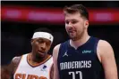  ?? ?? Luka Doncic of the Dallas Mavericks reacts beside Torrey Craig of the Phoenix Suns during the fourth quarter of Thursday’s game. Photograph: Ron Jenkins/Getty Images