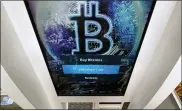  ?? CHARLES KRUPA — THE ASSOCIATED PRESS ?? The Bitcoin logo appears on the display screen of a crypto currency ATM at the Smoker’s Choice store in Salem, N.H.