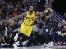  ?? TONY DEJAK — THE ASSOCIATED PRESS ?? Derrick Williams, left, drives past the Bucks’ Jason Terry in the second half on Feb. 27 in Cleveland.