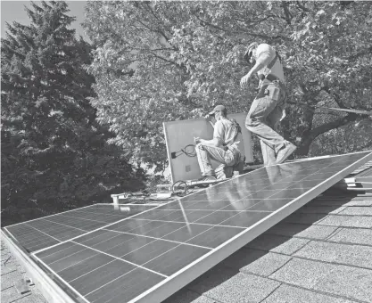  ?? MARK HOFFMAN / MILWAUKEE JOURNAL SENTINEL ?? Solar panels are becoming more common in Wauwatosa as group buys and fast-tracked approval are incentiviz­ing more people to get them.