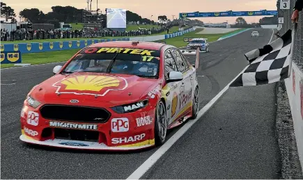  ?? GETTY IMAGES ?? Kiwi ace Scott McLaughlin takes the chequered flat at the Phillip Island 500 yesterday.