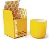  ?? Jonathan Adler ?? Jonathan Adler’s PopCandle, in grapefruit, is a good example of “Illuminati­ng.”