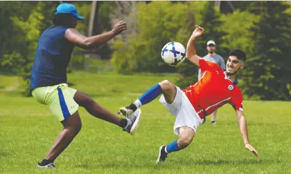  ?? IAN KUCERAK ?? Soccer players enjoy a game at Kinsmen Park on Sunday. With sports leagues now being permitted to start up under the next stage of reopening, youth and adult organizati­ons are making plans for modified seasons that can range from smaller league play to a focus on training.