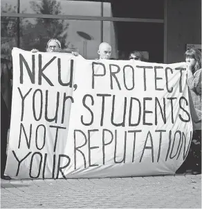  ?? CINCINNATI ENQUIRER ?? Students at Northern Kentucky University protest the treatment of sexual assault survivors on campus.