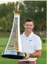 ?? ?? Rory Mcilroy with the Race to Dubai trophy at the Jumeirah Golf Estates on Sunday. — afp