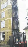  ?? ?? The fire escape staircase at County Hall overlooks the wall of Maidstone Prison