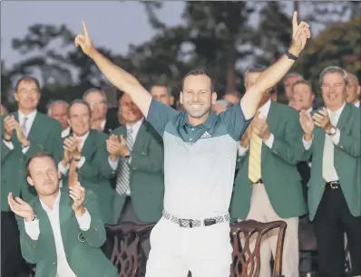  ?? PICTURE: AP ?? DELIGHT: Sergio Garcia points to the skies after winning a thrilling Masters showdown, watched by 2016 champion Danny Willett, left.