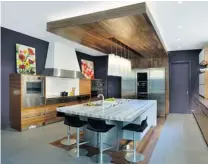  ?? LARRY ARNAL/ ARNAL PHOTOGRAPH­Y ?? Tim Scott of XTC Design in Toronto won Best Overall Kitchen at the 2014 Kitchen and Bath Industry Show in Las Vegas. Grey hues will be a big trend in kitchens and bathrooms in 2014.