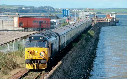  ?? IAN LOTHIAN ?? The GBRf-liveried Class 50s have been busy on tours in September, including visits to Penzance on September 18 and a week earlier making a very rare visit to Stranraer with the ‘Galloway Fifties’ from Tame Bridge Parkway – Nos. 50049 Defiance and 50007 Hercules pictured leaving the Scottish terminus for Ayr, where the locos were paired up again.