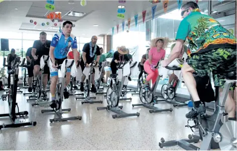  ?? LAURA BARTON/ WELLAND TRIBUNE ?? Led by an instructor, a group of people pedals hard for a cycling session during the annual Move for Kids event at the Niagara Centre YMCA in Welland. The event, which took place at each YMCA of Niagara location Saturday, raised money for children who...