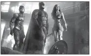  ??  ?? Ezra Miller stars as the Flash, Ben Affleck as Batman and Gal Gadot is Wonder Woman in the Warner Bros. action adventure Justice League. It led the box office last weekend and made about $94 million.