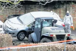  ??  ?? CLEAN-UP A car is removed from a car park in the Wiltshire city