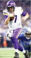  ?? GETTY IMAGES ?? Vikings quarterbac­k Case Keenum scores on a nine- yard run in the first quarter.
|