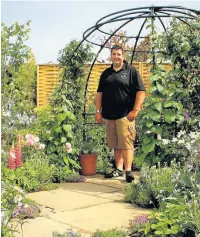  ??  ?? Ric Gibbons, from Paul Gibbons Landscapin­g, won a medal for his garden at Tatton Park RHS
