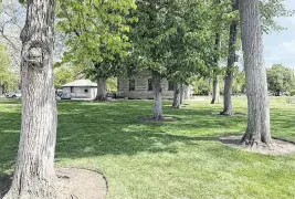  ?? SCOTT MCINTOSH smcintosh@idahostate­sman.com ?? Even today, a visitor to the U.S. Assay Office site at 210 W. Main St., Boise, can see the double row of American linden trees planted on the grounds 120 years ago. The trees mimic the Unter den Linden in Berlin. Boise’s first chief assayer was Albert Wolters, a German-american immigrant.