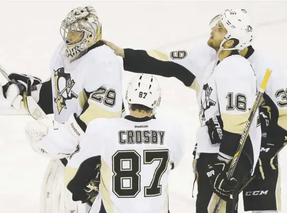  ?? Julie Jacobson/Associated Press photos ?? Brandon Sutter, David Perron and Sidney Crosby console goaltender Marc-Andre Fleury after the New York Rangers scored in overtime to win Game 5 and eliminate the Penguins from the Stanley Cup playoffs in the first round Friday night at Madison Square...