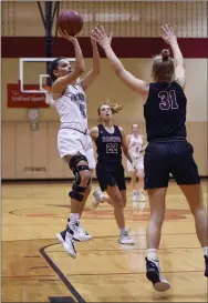  ?? MICHAEL REEVES — FOR MEDIANEWS GROUP ?? Great Valley’s Ashley Sullivan takes a shot in the second quarter over Radnor’s Ellie Mueller Tuesday night.