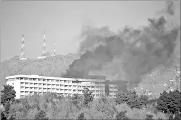  ??  ?? File photo shows smoke rising from the Interconti­nental Hotel during an attack in Kabul, Afghanista­n. — Reuters photo