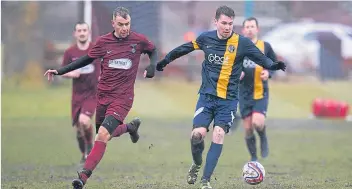  ??  ?? Park Tool, on the ball against Fintry, had their eye in at the penalty shootout, winning 4-3 after a 3-3 divide in regulation time.