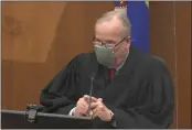  ?? COURT TV VIA AP ?? Hennepin County Judge Peter Cahill discusses pre-trial motions, prior to continuing jury selection, Friday in the trial of former Minneapoli­s police officer Derek Chauvin at the Hennepin County Courthouse in Minneapoli­s, Minn.