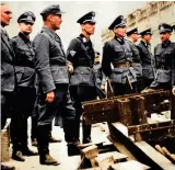  ?? ?? Below: On Hühnlein’s death in 1942, Erwin Kraus took over (centre with peaked cap and NSKK insignia on right upper sleeve). Here he is touring NSKK units in occupied France