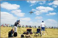  ??  ?? Plane spotters take pictures and videos of an Airbus A380 as it takes off during the Internatio­nal Paris Air Show in Le Bourget near
Paris on June 23. (AFP)