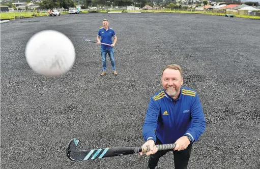  ?? PHOTO: PETER MCINTOSH ?? Not long now . . . At the new hockey turf at King’s High School are Otago Hockey Associatio­n pathways manager Hymie Gill (front) and Otago Hockey Associatio­n general manager Andy McLean.