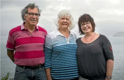  ?? PHOTO: ROSA WOODS/STUFF ?? Murray and Sharon Major, left, survived the Wahine Disaster in Wellington Harbour with their daughter, Sarah, who was just six-months-old at the time. The ship sunk at the mouth of Wellington Harbour, just around the point behind them.