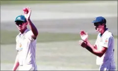  ?? AFP ?? Australia’s Josh Hazlewood (left) after taking five Indian wickets as India is dismissed for only 36 runs on the third day of the first cricket Test match between Australia and India played in Adelaide on Saturday.