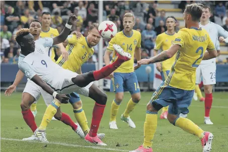  ??  ?? Tammy Abraham tries a spectacula­r overhead kick in England Under-21s’ 0-0 draw with Sweden last night.