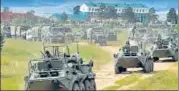  ?? AP ?? Russian armoured personnel carriers roll out during the drill.