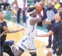  ??  ?? Norfolk State’s Tyrese Jenkins, right, battles for possession of the ball with Old Dominion’s A.J. Oliver.