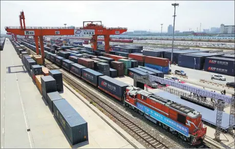  ?? TANG ZHENJIANG / FOR CHINA DAILY ?? A China-Europe freight train carrying imported automobile­s arrives at Xinzhu Station in Xi’an, capital of Shaanxi province, in June last year.