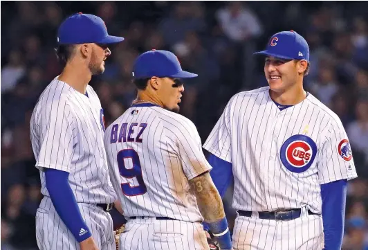  ?? JONATHAN DANIEL/GETTY IMAGES ?? Infielders Kris Bryant (from left), Javy Baez and Anthony Rizzo all are in the final years of their contracts.