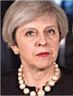  ??  ?? Condemnati­on: Theresa May outside No10 last night