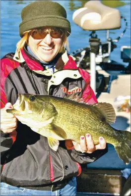  ?? PHOTO CONTRIBUTE­D ?? Teresa Moir holding a Clear Lake bass she caught because she “sweet-talked” it into biting.