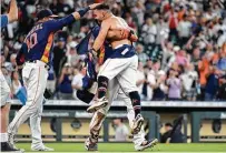  ?? Eric Christian Smith / Associated Press ?? Second baseman Jose Altuve, right, celebrates his game-winning three-run homer with first baseman Yuli Gurriel, left, and designated hitter Michael Brantley.