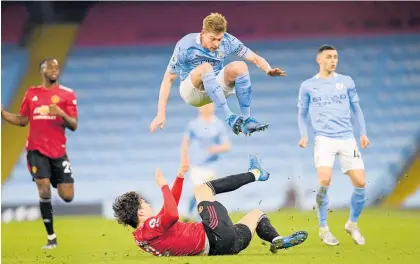  ?? Photo / AP ?? City’s Kevin De Bruyne leaps over United’s Victor Lindelof during the Manchester derby yesterday.