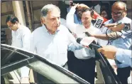  ??  ?? India’s Tata Group’s interim Chairman Ratan Tata (second left), leaves Bombay House, the company’s head office, in Mumbai on Oct 25. Shares in Tata Sons companies fell in early trade on Oct 25 after India’s biggest conglomera­te shocked the Indian business world and abruptly sacked its chairman Cyrus Mistry. (AFP)