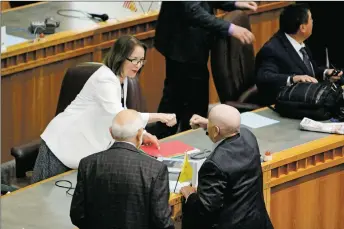  ?? NEW MEXICAN FILE PHOTO ?? Sen. Mimi Stewart (D-Albuquerqu­e), fist-bumps the late Sen. John Pinto of Gallup, after a special session in 2017.